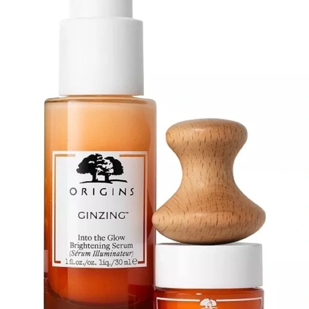 Origins radiance boosting serum , eye cream set and eye massage tool